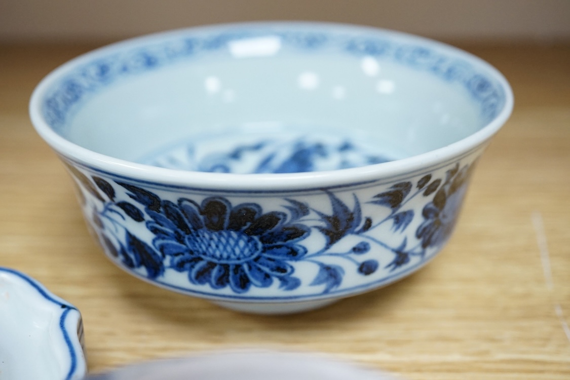 Two Chinese blue and white bowls and a lotus shaped tea pot stand, largest 15cm in diameter